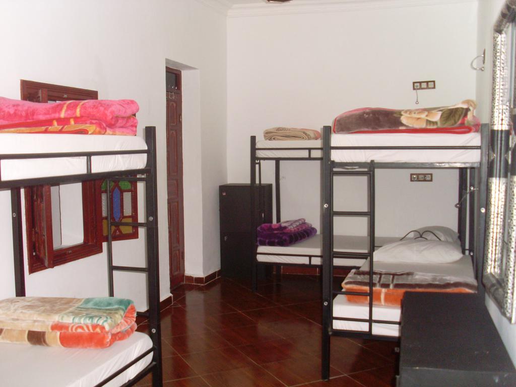 Cama en habitación compartida de 8 camas
